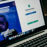 Close-up view of a laptop displaying a sign-up page for an online platform.